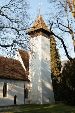 Thun, Switzerland, February 12, 2023 Little Scherzligen church in a small park on a sunny dayの写真素材