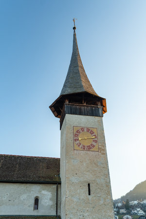Spiez, Canton Bern, Switzerland, February 12, 2023 Small catholic chapel at the coast of the lake of Thun on a sunny dayの写真素材