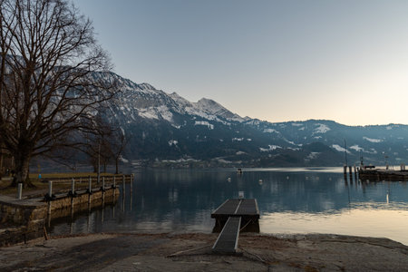 Unterseen, Canton Bern, Switzerland, February 12, 2023 Mountain scenery at the lake of Thun in the lake afternoonの写真素材