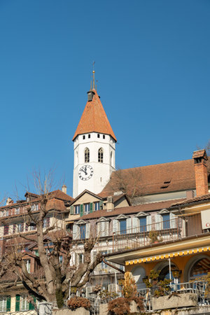 Thun, Switzerland, February 13, 2023 View over the city center with the historic old church on a...