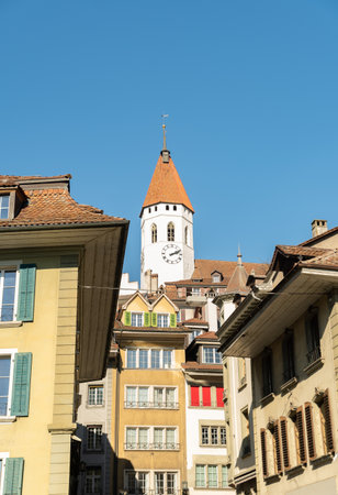 Thun, Switzerland, February 13, 2023 View over the city center with the historic old church on a...