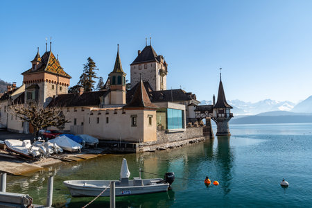 Oberhofen, Canton Bern, Switzerland, February 12, 2023 Stunning castle Oberhofen at the lake of Thun on a sunny dayのeditorial素材