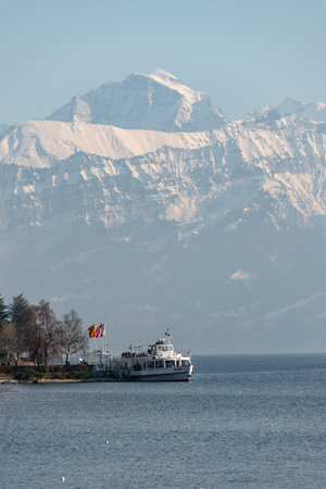 Thun, Switzerland, February 12, 2023 Little boat with passengers on a cruise trip over the lake of Thunのeditorial素材