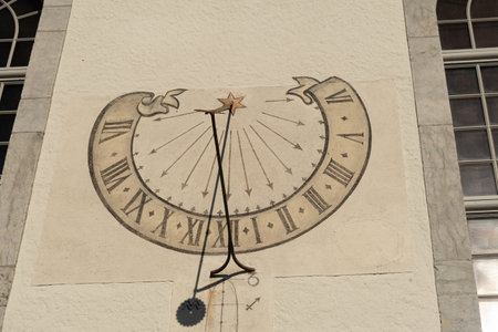 Thun, Switzerland, February 13, 2023 Historic old sundial painted on a wallのeditorial素材