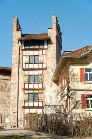 Thun, Switzerland, February 13, 2023 Historic buildings and a little green park in the city centerのeditorial素材