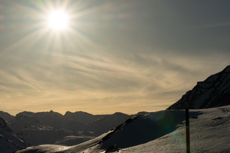 Julier pass, Switzerland, February 21, 2023 Alpine winter wonderland on the top of the Julier pass street on a sunny dayの写真素材