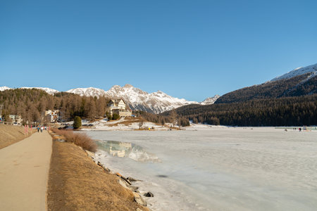 Saint Moritz, Switzerland, February 21, 2023 Frozen lake of Saint Moritz and a magnificent alpine panorama on a sunny dayの写真素材