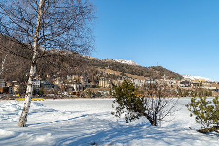Saint Moritz, Switzerland, February 21, 2023 Frozen lake of Saint Moritz and a magnificent alpine panorama on a sunny dayの写真素材
