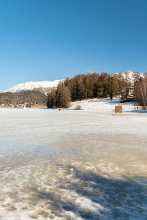 Saint Moritz, Switzerland, February 21, 2023 Frozen lake of Saint Moritz and a magnificent alpine...