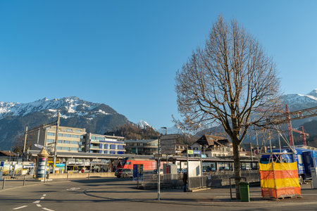 Interlaken, Switzerland, February 10, 2023 Little square with some traffic in the city centerのeditorial素材