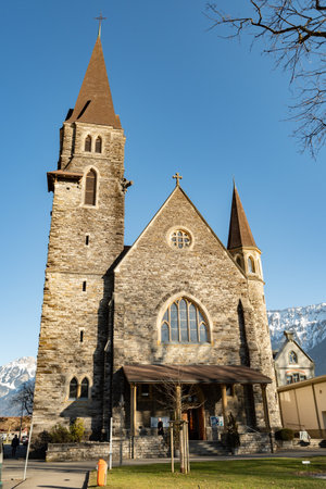 Interlaken, Switzerland, February 10, 2023 Historic old catholic church in the city centerのeditorial素材