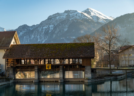 Interlaken, Switzerland, February 10, 2023 Historic old mill sluice at the Aare river in the city centerのeditorial素材