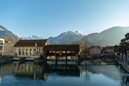 Interlaken, Switzerland, February 10, 2023 Historic old mill sluice at the Aare river in the city centerのeditorial素材