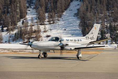 Samedan, Switzerland, February 21, 2023 Cessna 425 Conquest multi engine propeller aircraft is taxiing to its positionのeditorial素材