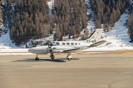 Samedan, Switzerland, February 21, 2023 Cessna 425 Conquest multi engine propeller aircraft is taxiing to its positionのeditorial素材