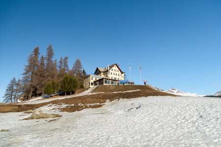 Saint Moritz, Switzerland, February 21, 2023 Building of the hotel Waldhaus am See on a little hillのeditorial素材