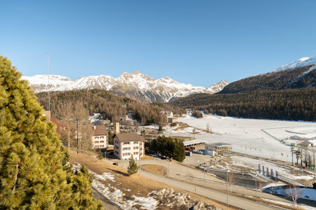 Saint Moritz, Switzerland, February 21, 2023 Frozen lake of Saint Moritz and a magnificent alpine panorama on a sunny dayのeditorial素材