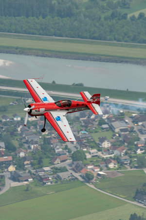 Rhine Valley, Saint Gallen, Switzerland, May 20, 2023 HB-MSS Sukhoi SU-26M propeller airplane is performing during an air show seen from the top of the mount hoher Kastenのeditorial素材