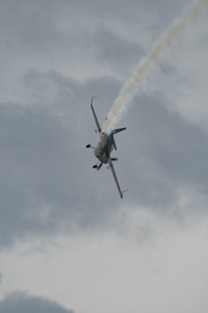 Rhine Valley, Saint Gallen, Switzerland, May 20, 2023 N-540TS Zivko Edge 540-TK propeller airplane is performing during an air show swwn from the top of the mount hoher Kastenのeditorial素材
