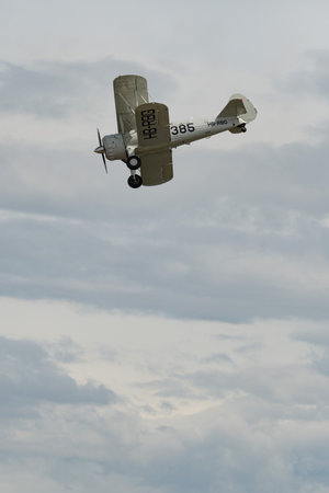 Rhine Valley, Saint Gallen, Switzerland, May 20, 2023 HB-RBG Boeing Stearman Model 75 double decker propeller airplane is performing during an air show seen from the top of the mount hoher Kastenのeditorial素材