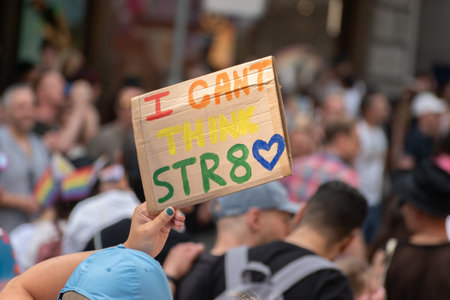 Zurich, Switzerland, June 17, 2023 Protesters in the city center holding up their sign with a message during the pride paradeのeditorial素材