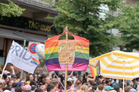 Zurich, Switzerland, June 17, 2023 Protesters in the city center holding up their sign with a message during the pride paradeのeditorial素材