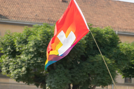 Zurich, Switzerland, June 17, 2023 Rainbow colored swiss flag during the gay pride parade in the city centerのeditorial素材