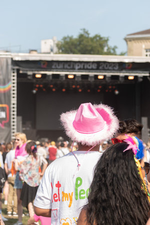 Zurich, Switzerland, June 17, 2023 Person with a pink hat at the pride festival in the city centerのeditorial素材