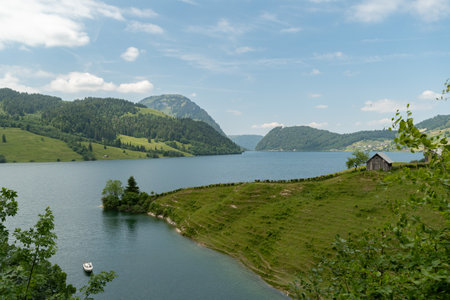 Waegital, Canton Schwyz, Switzerland, June 13, 2023 Fantastic view over the beautiful lake Waegitalersee surrounded by the majestic swiss alps on a sunny dayの写真素材