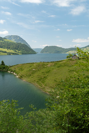 Waegital, Canton Schwyz, Switzerland, June 13, 2023 Fantastic view over the beautiful lake Waegitalersee surrounded by the majestic swiss alps on a sunny dayの写真素材