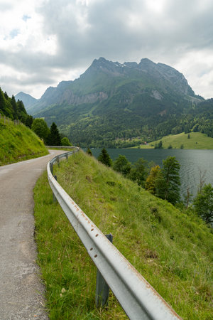 Waegital, Canton Schwyz, Switzerland, June 13, 2023 Fantastic view over the beautiful lake Waegitalersee surrounded by the majestic swiss alps on a sunny dayの写真素材