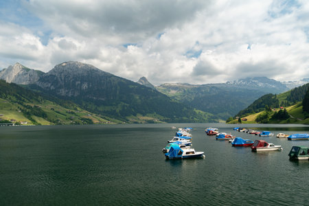 Waegital, Canton Schwyz, Switzerland, June 13, 2023 Little boats are drifting on the surface of the lake Waegitalerseeの写真素材