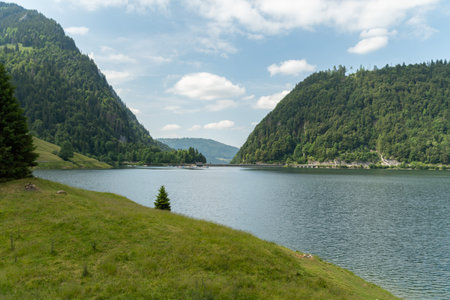 Waegital, Canton Schwyz, Switzerland, June 13, 2023 Fantastic view over the beautiful lake Waegitalersee surrounded by the majestic swiss alps on a sunny dayの写真素材
