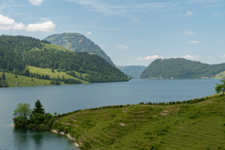 Waegital, Canton Schwyz, Switzerland, June 13, 2023 Fantastic view over the beautiful lake Waegitalersee surrounded by the majestic swiss alps on a sunny dayの写真素材