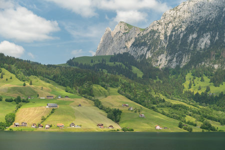 Waegital, Canton Schwyz, Switzerland, June 13, 2023 Fantastic view over the beautiful lake Waegitalersee surrounded by the majestic swiss alps on a sunny dayの写真素材