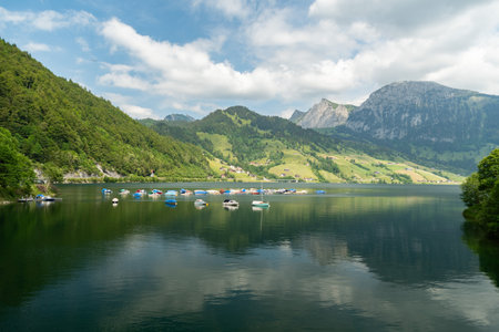 Waegital, Canton Schwyz, Switzerland, June 13, 2023 Fantastic view over the beautiful lake Waegitalersee surrounded by the majestic swiss alps on a sunny dayの写真素材