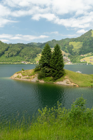 Waegital, Canton Schwyz, Switzerland, June 13, 2023 Fantastic view over the beautiful lake Waegitalersee surrounded by the majestic swiss alps on a sunny dayの写真素材