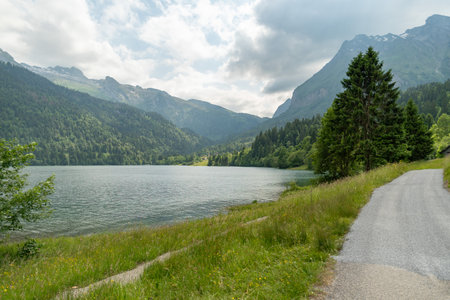 Waegital, Canton Schwyz, Switzerland, June 13, 2023 Fantastic view over the beautiful lake Waegitalersee surrounded by the majestic swiss alps on a sunny dayの写真素材