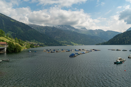 Waegital, Canton Schwyz, Switzerland, June 13, 2023 Little boats are drifting on the surface of the lake Waegitalerseeの写真素材