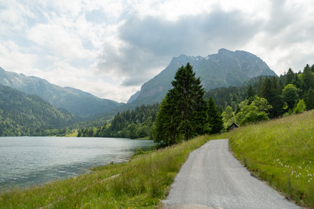 Waegital, Canton Schwyz, Switzerland, June 13, 2023 Fantastic view over the beautiful lake Waegitalersee surrounded by the majestic swiss alps on a sunny dayの写真素材