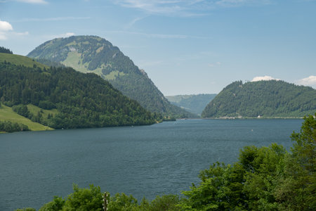 Waegital, Canton Schwyz, Switzerland, June 13, 2023 Fantastic view over the beautiful lake Waegitalersee surrounded by the majestic swiss alps on a sunny dayの写真素材