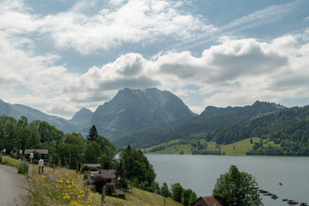 Waegital, Canton Schwyz, Switzerland, June 13, 2023 Fantastic view over the beautiful lake Waegitalersee surrounded by the majestic swiss alps on a sunny dayの写真素材