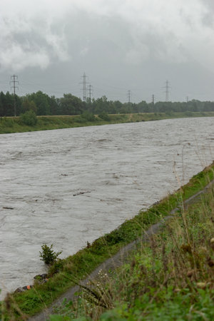 Bendern, Liechtenstein, August 28, 2023 Strong flood at the rhine river during a severe rain showerの写真素材