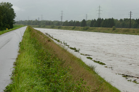 Gamprin, Liechtenstein, August 28, 2023 Strong flood at the rhine river during a severe rain showerの写真素材
