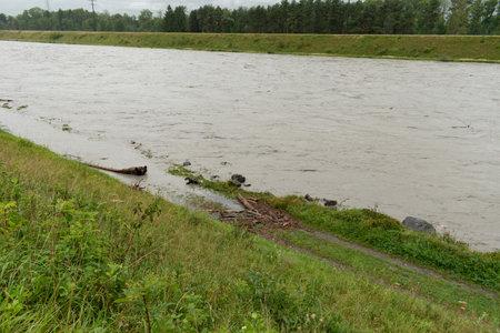 Gamprin, Liechtenstein, August 28, 2023 Strong flood at the rhine river during a severe rain showerの写真素材