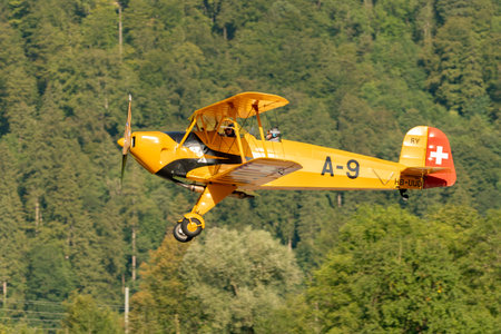 Mollis, Switzerland, August 18, 2023 HB-UUD Buecker 131 Jungmann aircraft landing on runway 19のeditorial素材
