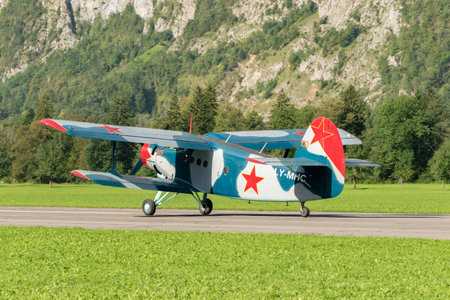 Mollis, Switzerland, August 18, 2023 LY-MHC Antonov AN-2 historic old double decker aircraft is landing on runway 19のeditorial素材