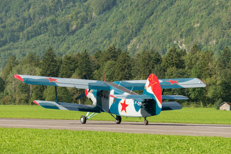 Mollis, Switzerland, August 18, 2023 LY-MHC Antonov AN-2 historic old double decker aircraft is landing on runway 19のeditorial素材