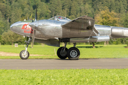 Mollis, Switzerland, August 18, 2023 N-25Y Lockheed P-38L Lightning aircrafton the runwayのeditorial素材
