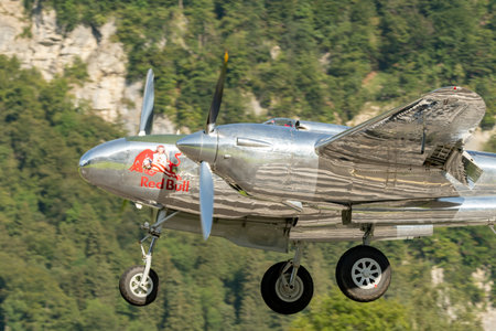 Mollis, Switzerland, August 18, 2023 N-25Y Lockheed P-38L Lightning aircraft is taking off from runway 19のeditorial素材